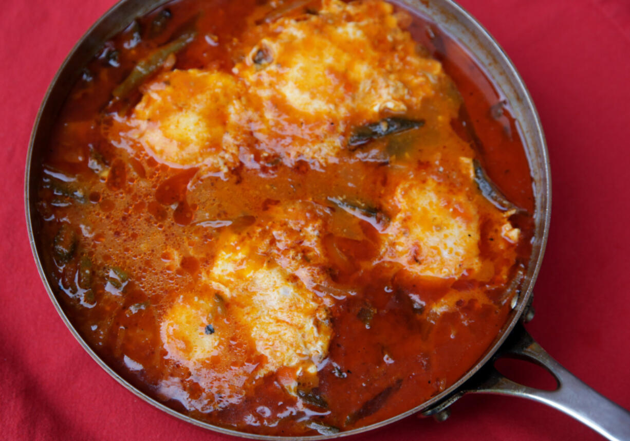 Eggs Poached in a Chile-Tomato Broth, a recipe with peppers. (Hillary Levin/St.