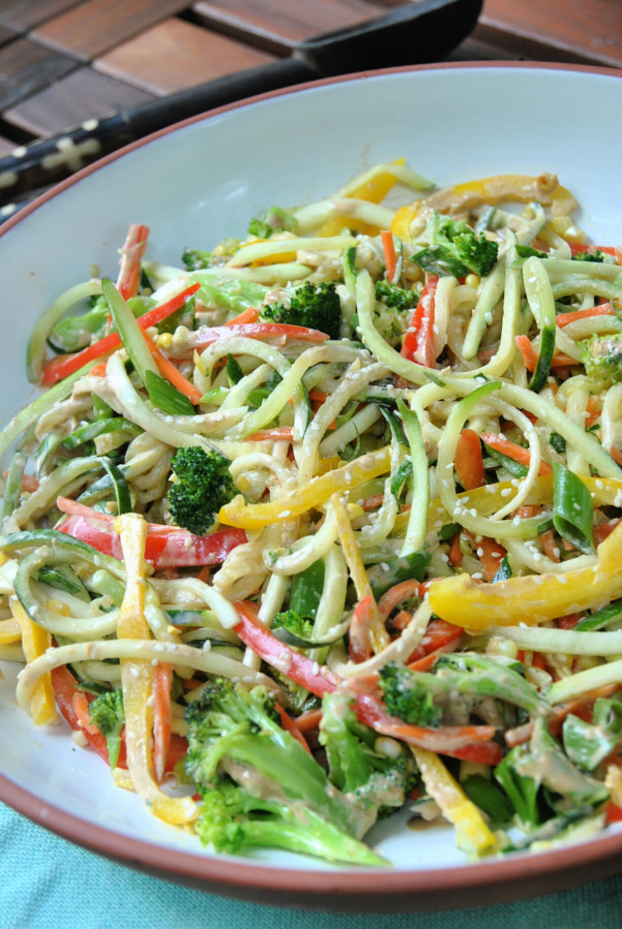 A zucchini noodle salad with an East Asian-inspired tahini-ginger dressing is an easy, low-carb summer dish.