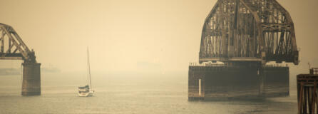 A sailboat makes its way past the railroad bridge in Vancouver through the smoke on Sept. 10, 2020. Smoke events in Vancouver tend to be weather-dependent, occurring when east winds bring smoke from elsewhere in the state to the western half.