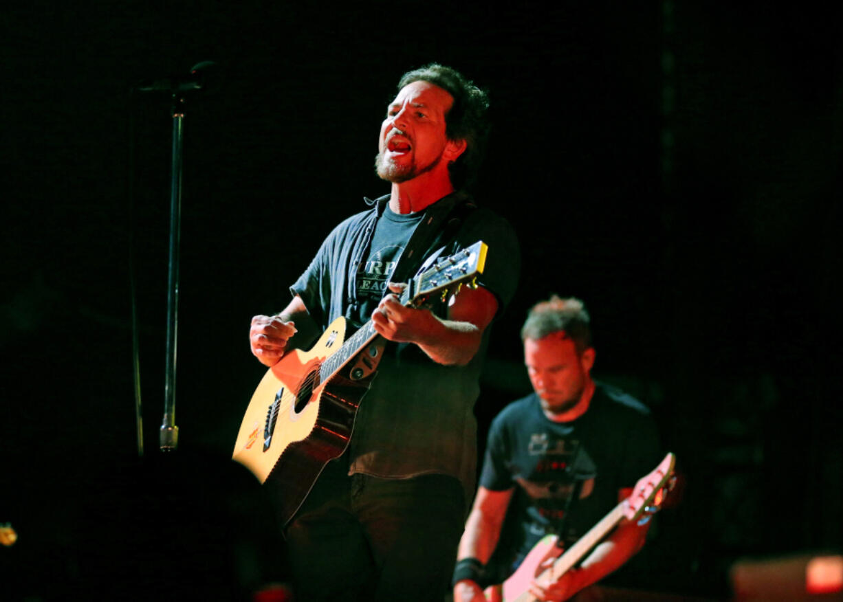 Eddie Vedder, left, and Jeff Ament of Pearl Jam perform at Wrigley Field on Saturday, Aug. 20, 2016, in Chicago.