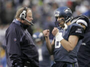 The Seattle Seahawks will honor former quarterback Matt Hasselbeck, right, on Oct. 25, 2021, and former head coach Mike Holmgren, left, on Oct. 31, 2021, as both will have their names added to the Seahawks Ring of Honor at Lumen Field in Seattle.