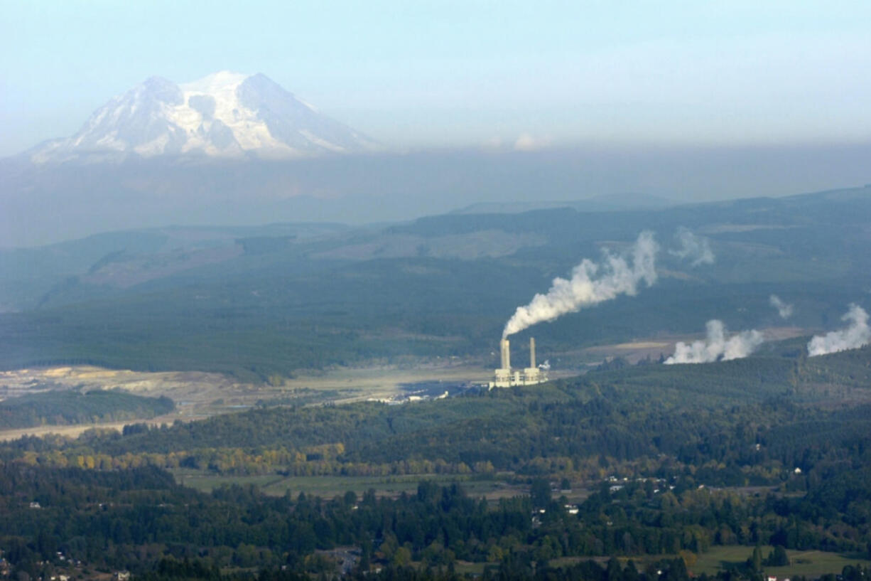 Brandon Swanson / bswanson@chronline.com The TransAlta steam plant near Centralia is seen from the air Oct. 7. Boxcars filled with coal for the TransAlta steam power plant wait on railroad tracks outside Centralia Feb. 24.