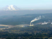 Brandon Swanson / bswanson@chronline.com The TransAlta steam plant near Centralia is seen from the air Oct. 7. Boxcars filled with coal for the TransAlta steam power plant wait on railroad tracks outside Centralia Feb. 24.