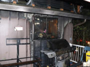 A propane grill fire destroyed a house in the Cascade Park area Monday night and displaced four residents.
