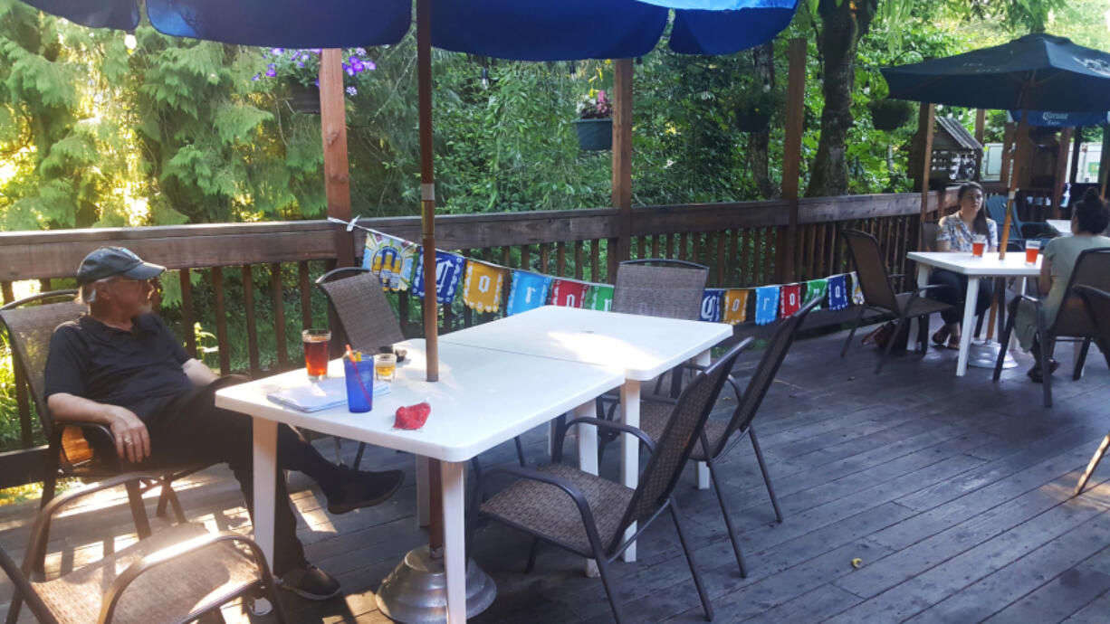 Nick's Bar and Grill is known for its thick-cut, beer-battered onion rings. The shady back deck overlooks Cedar Creek.