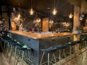 The supper club portion of Acorn & The Oak features wood and metal decor.