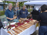 Visitors to the 2019 Washougal Art Festival browse the wares at a booth. This year's festival is Saturday in Reflection Plaza.