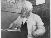 Sitting at a desk in this 1920 photo, Patrick "Paddy" Hough, a retired Vancouver High School principal, makes notes. He died in 1925. Vancouver residents so loved the gentle teacher, they named the Hough neighborhood and Hough Elementary after him. Casually glancing at this photo, his hand appears in a coat pocket. A closer look shows an empty lower sleeve. He lost part of his arm during the Franco-Prussian War (1870-71).