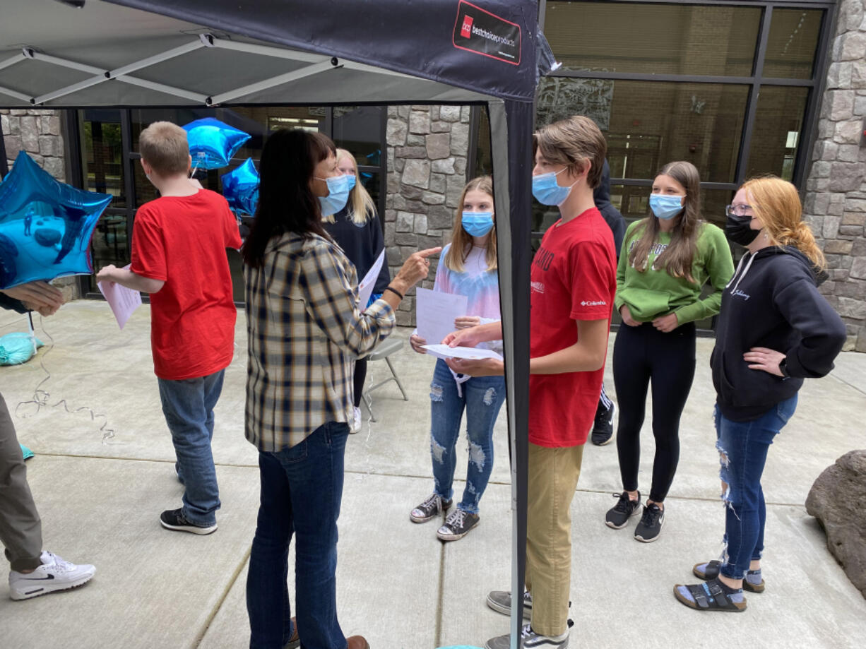 WASHOUGAL: Michele Mederos welcomes Jemtegaard Middle School students the AVID program.