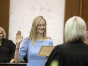 Abigail Bartlett, center, is sworn in as a District Court judge at the Clark County Courthouse on Thursday afternoon. She previously served as a District Court commissioner and takes over the seat previously held by Judge John Hagensen.