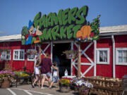 Shoppers at Bi-Zi Farms enter the farmers market to search for fresh produce. The farm has been in the Zimmerman family since 1872 and the Bi-Zi Farms retail operation has been going since 1985.