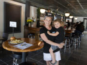 Mav's Taphouse owner Calista Crenshaw pauses for a portrait with her son, Maverick Britt in downtown Vancouver on Wednesday afternoon. The new taphouse is named in honor of Maverick.