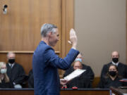 Judge James Smith is sworn into District Court at the Clark County Courthouse on Tuesday afternoon. Smith will have to run for election in 2022 to keep the seat.