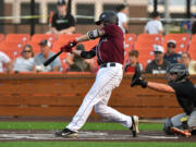 Ridgefield's Tanner Jacques hits the ball Saturday, Aug. 14, 2021, during the Raptors' 13-6 loss to Corvallis in a playoff game at the Ridgefield Outdoor Recreation Complex.