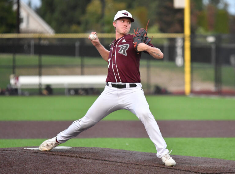 Ridgefield pitcher Parker Goin warms up Saturday, Aug. 14, 2021, during the Raptors' 13-6 loss to Corvallis in a playoff game at the Ridgefield Outdoor Recreation Complex.