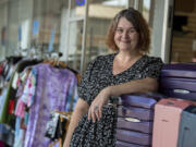 Jullienne Adams, owner and founder of LiquidNation, stands outside her Vancouver shop Wednesday morning.