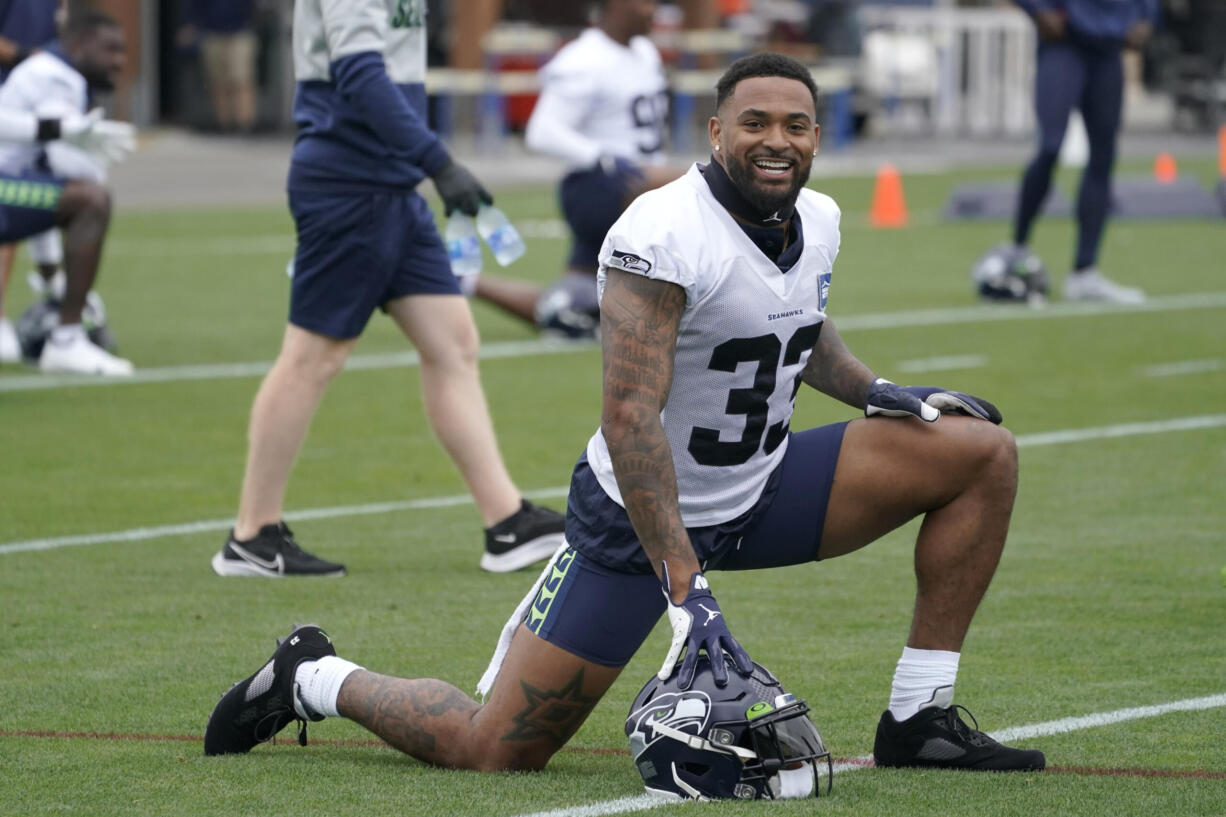 Seattle Seahawks safety Jamal Adams stretches before practice Tuesday, Aug. 17, 2021, in Renton. The Seahawks signed Adams to a four-year contract extension Tuesday that is expected to make the former All-Pro the highest-paid safety in the NFL. (AP Photo/Ted S.