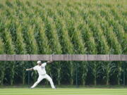 Chicago White Sox pitcher Lance Lynn warms up in the outfield before a baseball game against the New York Yankees, Thursday, Aug. 12, 2021 in Dyersville, Iowa. The Yankees and White Sox are playing at a temporary stadium in the middle of a cornfield at the Field of Dreams movie site, the first Major League Baseball game held in Iowa.