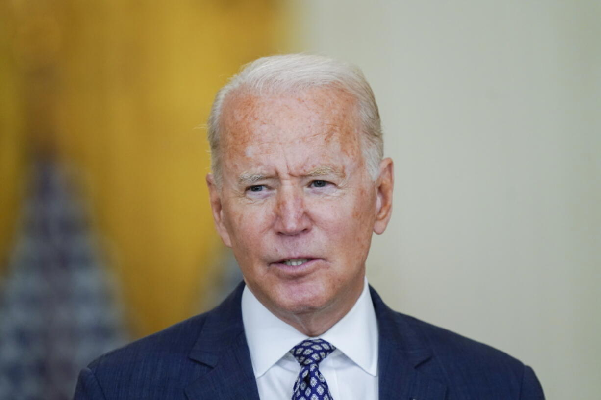 FILE - In this Aug. 20, 2021, file photo President Joe Biden speaks about the evacuation of American citizens, their families, SIV applicants and vulnerable Afghans in the East Room of the White House in Washington. President Joe Biden's job approval rating has ticked down and Americans are taking a notably less positive view of his handling of the coronavirus pandemic. That's according to a new poll from The Associated Press-NORC Center for Public Affairs Research. The survey shows Biden's overall job approval rating dipping from 59% last month to 54%.