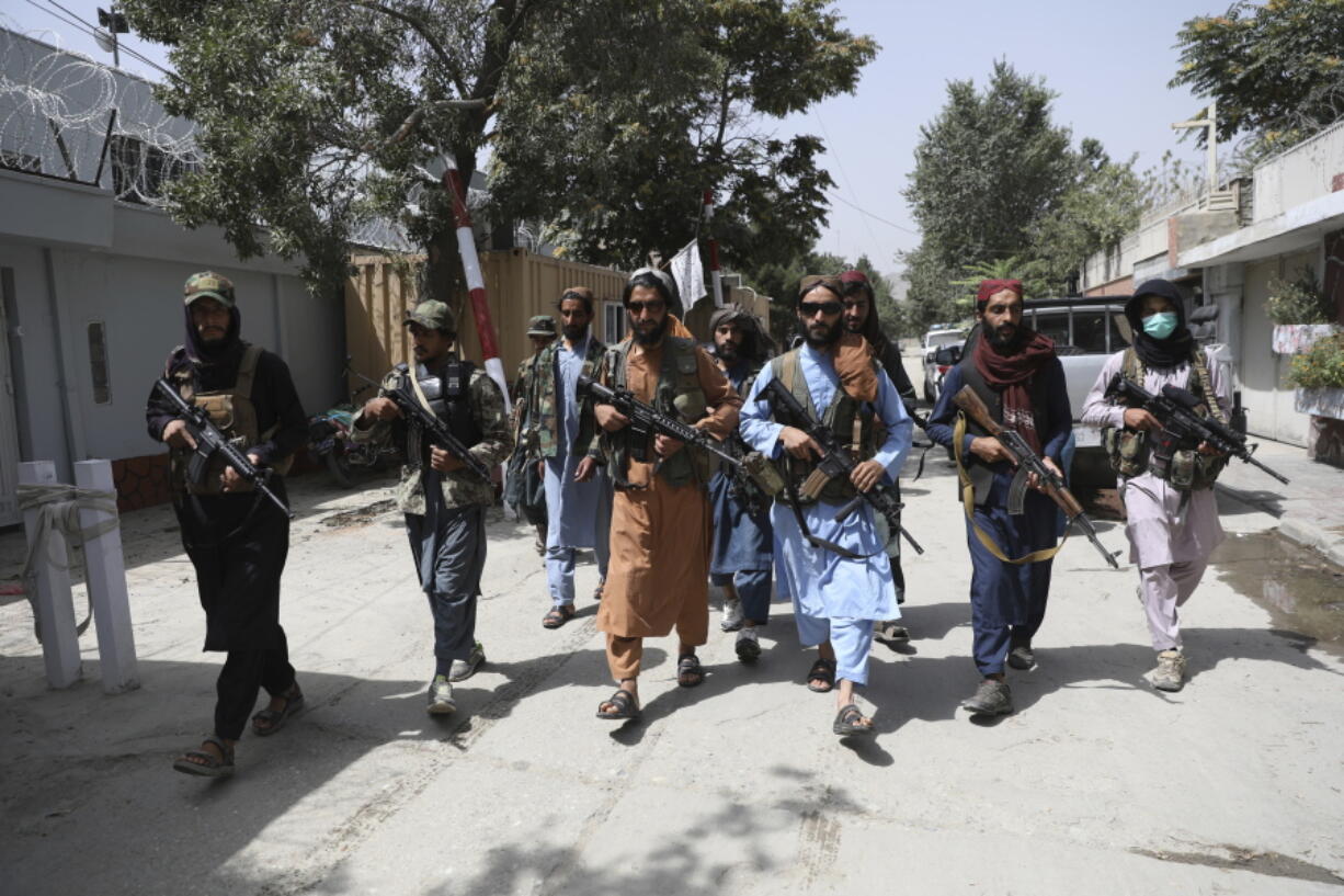 Taliban fighters patrol in the Wazir Akbar Khan neighborhood in the city of Kabul, Afghanistan, Wednesday, Aug. 18, 2021. The Taliban declared an "amnesty" across Afghanistan and urged women to join their government Tuesday, seeking to convince a wary population that they have changed a day after deadly chaos gripped the main airport as desperate crowds tried to flee the country.