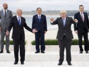 FILE - In this Friday, June 11, 2021 file photo, leaders of the G7 pose during a group photo at the G7 meeting at the Carbis Bay Hotel in Carbis Bay, St. Ives, Cornwall, England. When U.S. President Joe Biden took office early this year, Western allies were falling over themselves to welcome and praise him and hail a new era in trans-Atlantic cooperation. The collapse of Kabul certainly put a stop to that. Even some of his biggest fans are now churning out criticism.