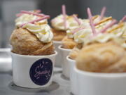 Strawberry Pocky Cruffins are displayed on a tray at the Sunday Bakeshop in Oakland, Calif., Thursday, Aug. 19, 2021. From ube cakes to mochi muffins, bakeries that sweetly encapsulate what it is to grow up Asian and American have been popping up more in recent years. Their confections are a delectable vehicle for young and intrepid Asian Americans to celebrate their dual identity.