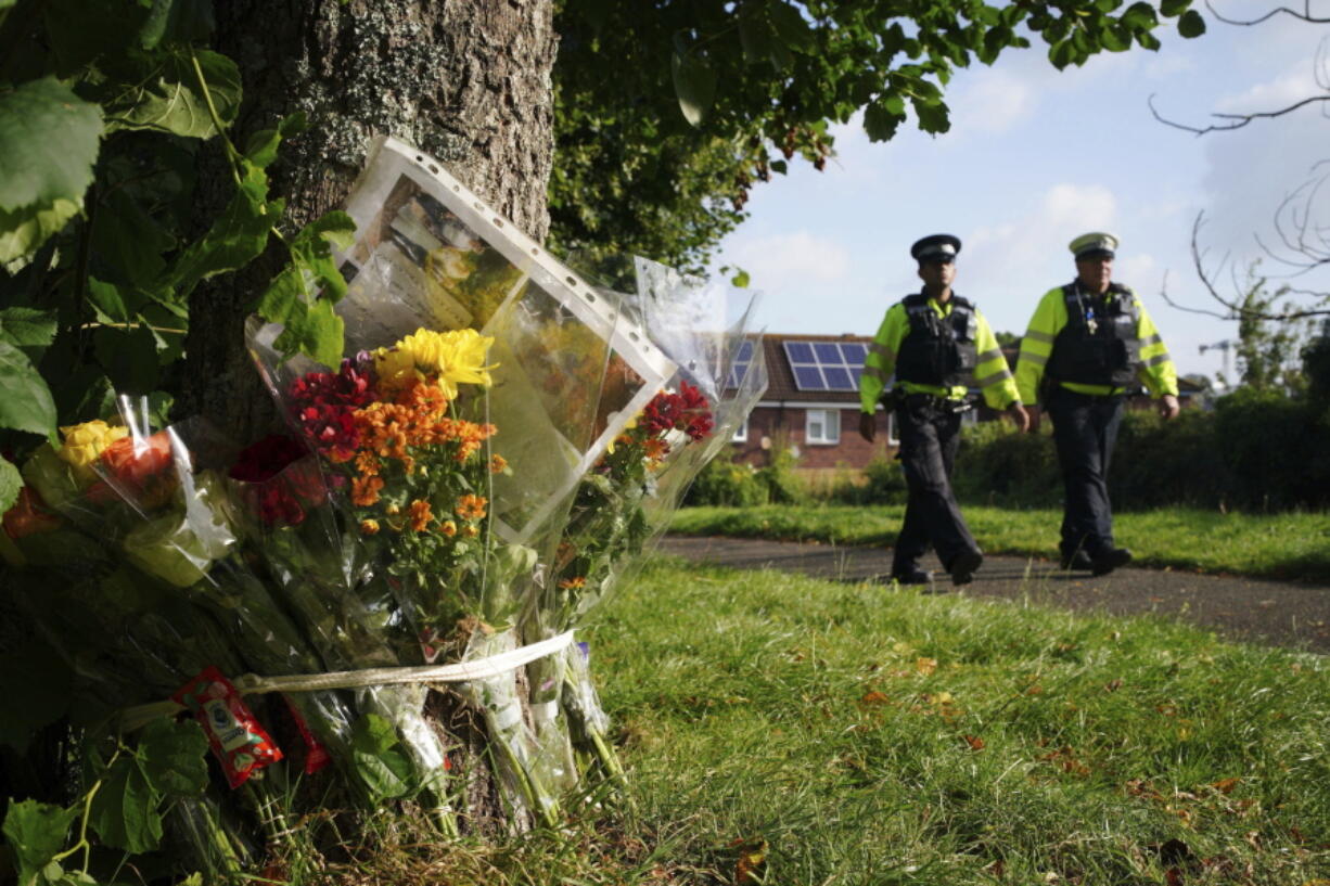 Floral tributes left near a home following a shooting incident in Plymouth, England, Monday Aug. 16, 2021. Police in southwest England say six people were killed, including the suspected shooter, in the city of Plymouth Thursday in a "serious firearms incident" that wasn't terror-related.