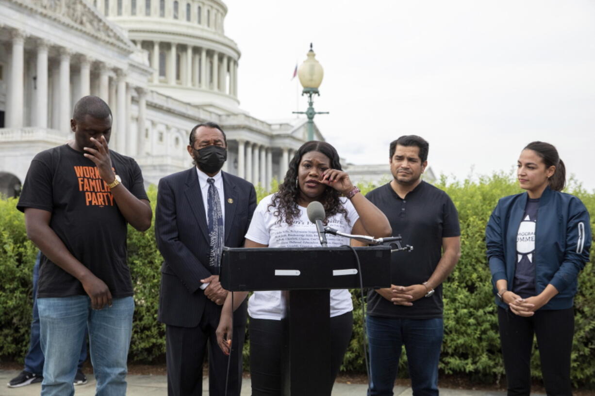 In this Aug. 3, 2021, photo, from left, Rep. Mondaire Jones, D-N.Y., Rep. Al Green, D-Texas, Rep. Cori Bush, D-Mo., Rep. Jimmy Gomez, D-Calif., and Rep. Alexandria Ocasio-Cortez, D-N.Y., after it was announced that the Biden administration will enact a targeted nationwide eviction moratorium outside of Capitol Hill in Washington. The rare clash this week between the Biden administration and congressional Democrats over a lapsed eviction moratorium could become a blueprint for even larger fights that lie ahead.