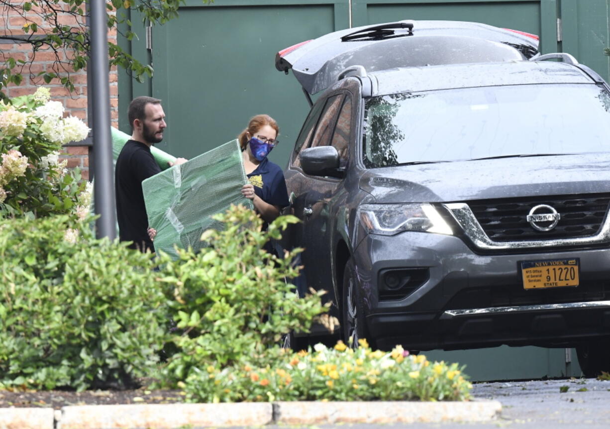 Crews from the Office of General Services load belongings of New York Gov. Andrew Cuomo into vehicles at the New York state Executive Mansion, Friday Aug. 20, 2021, in Albany, N.Y.    Lt. Gov. Kathy Hochul will become the first woman to be New York's governor when Cuomo's resignation becomes official on Aug. 24.