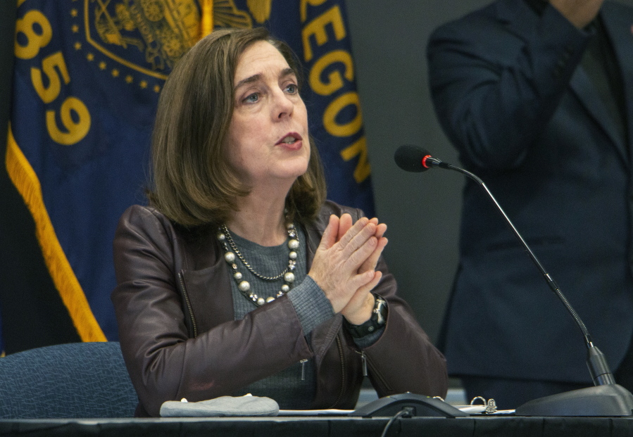 FILE - Oregon Gov. Kate Brown speaks on Nov. 10, 2020, in Portland, Ore. Next year could be a pivotal one for women gubernatorial candidates. Brown will be the only female incumbent barred from seeking re-election by term limits. Six male governors also will be term-limited, opening an easier path to office for candidates.