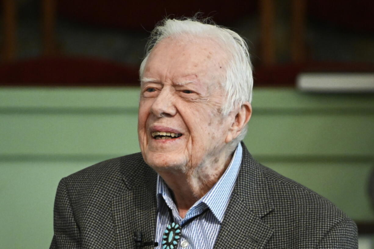 FILE - In this Nov. 3, 2019, file photo, former President Jimmy Carter teaches Sunday school at Maranatha Baptist Church in Plains, Ga. Carter is sometimes called a better former president than he was president. The backhanded compliment has always rankled Carter allies and, they say, the former president himself. Yet now, 40 years removed from the White House, the most famous resident of Plains, Georgia, is riding a new wave of attention as biographers, filmmakers, climate activists and Carter's fellow Democrats push for a recasting of his presidential legacy.