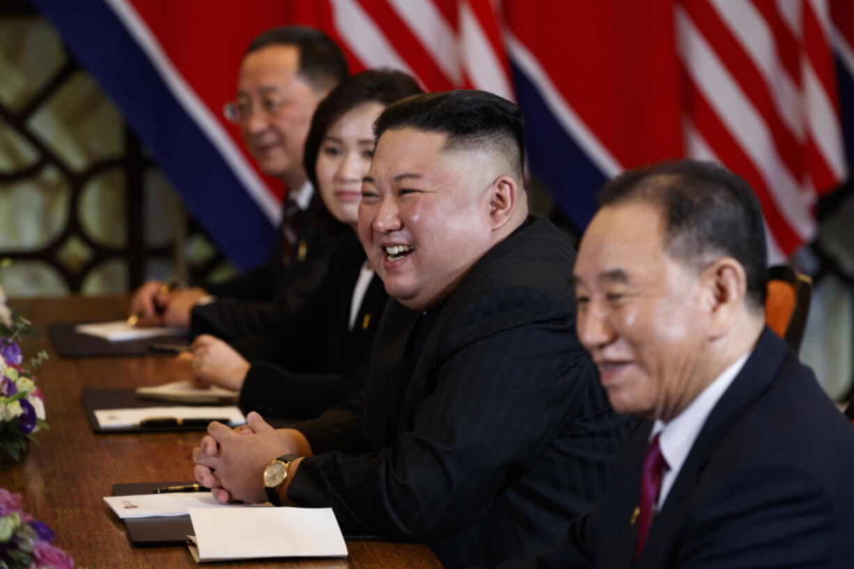 FILE - In this Feb. 28, 2019, file photo, North Korean leader Kim Jong Un smiles during a meeting with President Donald Trump, Thursday, Feb. 28, 2019, in Hanoi. at right is Kim Yong Chol, a North Korean senior ruling party official and former intelligence chief. North Korea on Wednesday, Aug. 11, 2021, repeated a threat to respond to U.S.-South Korean military exercises it claims are an invasion rehearsal, while the United States insisted the drills were "purely defensive in nature" to maintain the South's security.