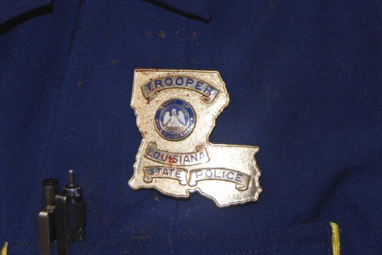 This May 10, 2019 photo provided by the Louisiana State Police shows blood stains on the shield and uniform of Master Trooper Chris Hollingsworth, in West Monroe, La., after troopers punched, dragged and stunned Black motorist Ronald Greene during his fatal 2019 arrest.