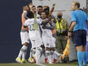 Portland Timbers midfielder Sebastian Blanco, center, celebrates with teammates after he scored a goal against the Seattle Sounders during the second half of an MLS soccer match, Sunday, Aug. 29, 2021, in Seattle. (AP Photo/Ted S.