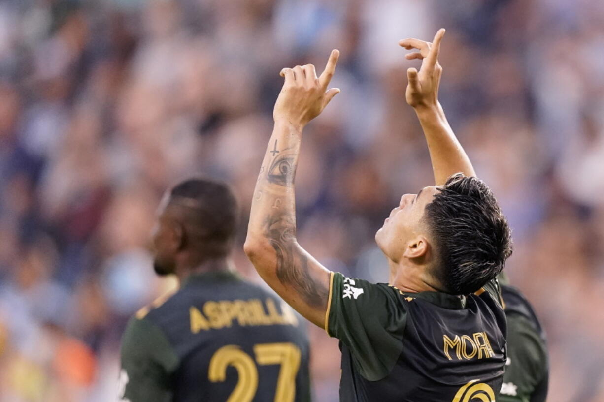 Portland Timbers forward Felipe Mora (9) celebrates after scoring a goal during the first half of an MLS soccer match against Sporting Kansas City Wednesday, Aug. 18, 2021, in Kansas City, Kan.