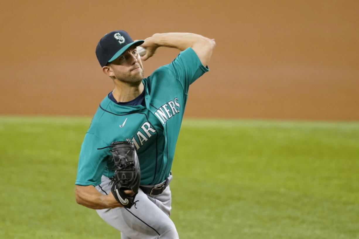 Seattle Mariners starting pitcher Tyler Anderson throws to a Texas Rangers batter during the first inning of a baseball game in Arlington, Texas, Tuesday, Aug. 17, 2021.