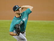 Seattle Mariners starting pitcher Tyler Anderson throws to a Texas Rangers batter during the first inning of a baseball game in Arlington, Texas, Tuesday, Aug. 17, 2021.