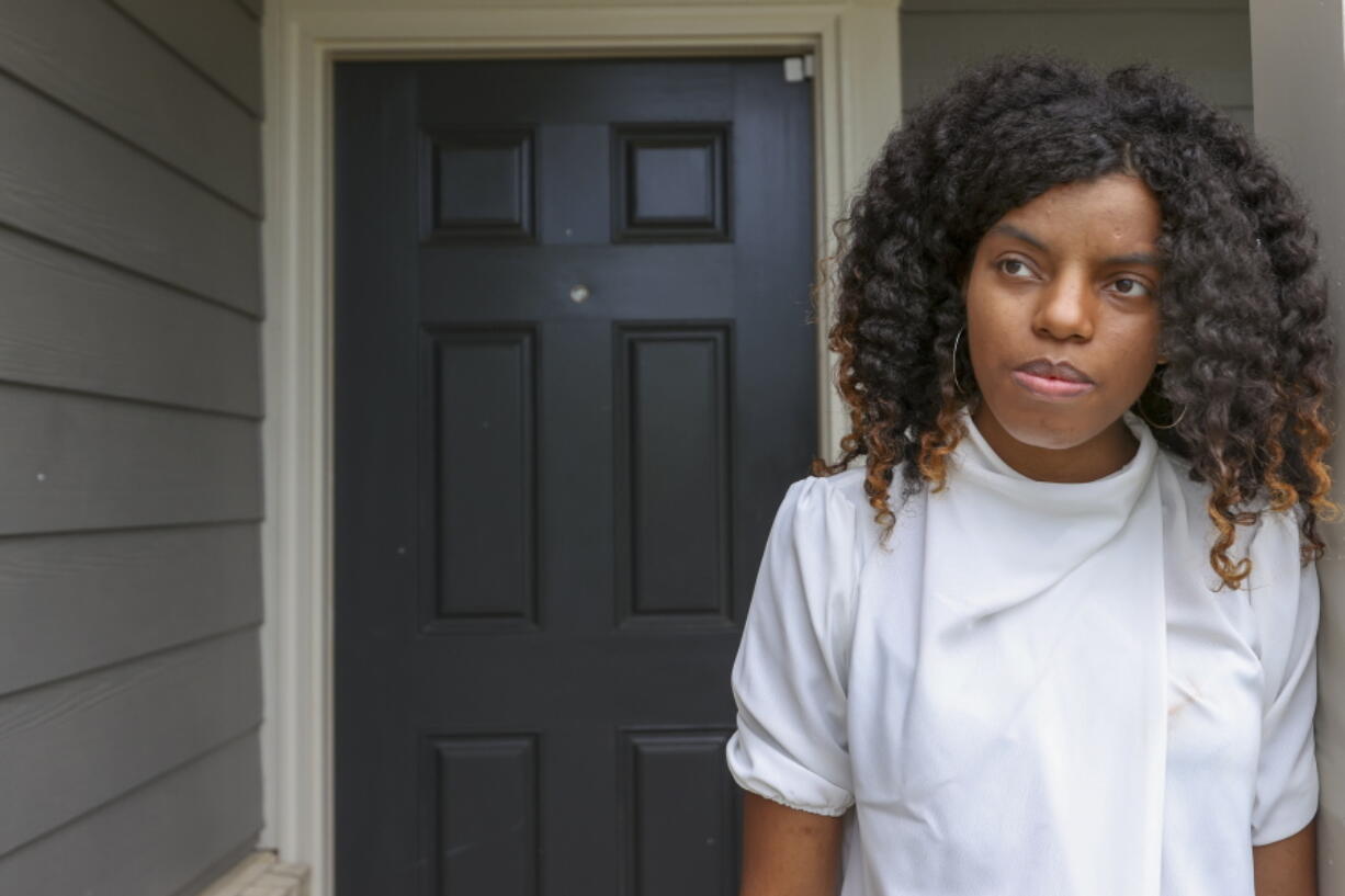 **HOLD FOR JUSTIN MYERS STORY** Crystal Marie McDaniels stands in front of her Charlotte, N.C.