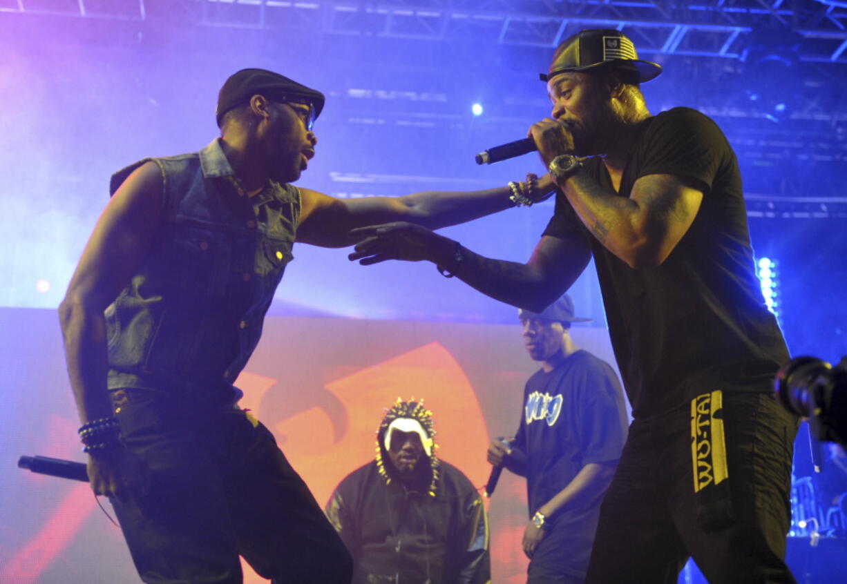 Robert Fitzgerald Diggs, aka RZA, left, and Clifford Smith, aka Method Man, of Wu-Tang Clan, right, perform at the 2013 Coachella Valley Music and Arts Festival in Indio, Calif.