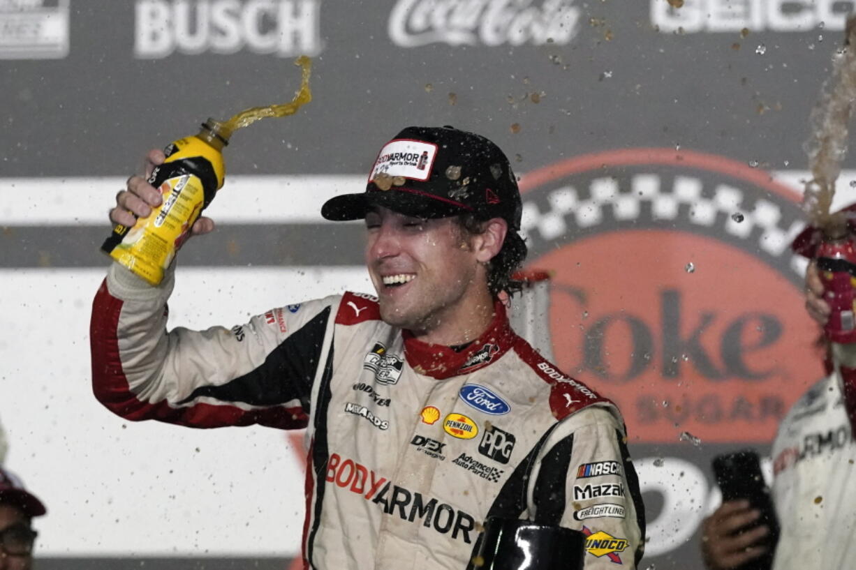 Ryan Blaney celebrates in Victory Lane after winning the NASCAR Cup Series auto race at Daytona International Speedway, Saturday, Aug. 28, 2021, in Daytona Beach, Fla.