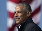 FILE - In this Nov. 2, 2020 file photo, former President Barack Obama speaks at a rally as he campaigns for Democratic presidential candidate former Vice President Joe Biden at Turner Field in Atlanta. Obama has scaled down his 60th birthday bash due to the surge in the delta variant of the coronavirus. A spokeswoman says the party planned for this weekend at his home on Martha's Vineyard is now limited to family and close friends. Obama, who turned 60 on Wednesday, had been criticized for planning a big celebration during a pandemic.