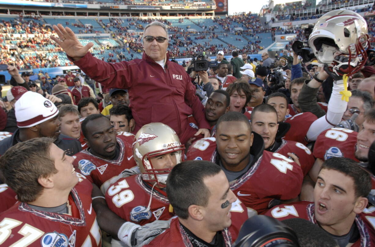 FILE - In this Jan. 1, 2010, file photo, Florida State head coach Bobby Bowden is carried on the shoulders of his players after their 33-21 win over West Virginia in the Gator Bowl NCAA college football game in Jacksonville, Fla. Bowden, the folksy Hall of Fame coach who built Florida State into an unprecedented college football dynasty, has died. He was 91. Bobby's son, Terry, confirmed to The Associated Press that his father died at home in Tallahassee, Fla., surrounded by family early Sunday, Aug. 8, 2021.