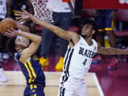 Portland Trail Blazers' Greg Brown III, right, fouls Indiana Pacers' Chris Duarte during the first half of an NBA summer league basketball game Thursday, Aug. 12, 2021, in Las Vegas.