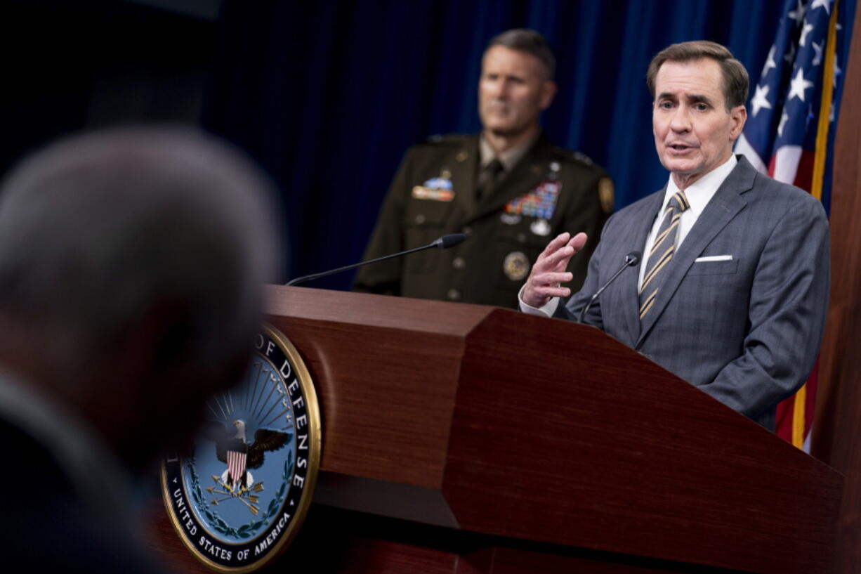 Pentagon spokesman John Kirby, accompanied by U.S. Army Major Gen. William Taylor, Joint Staff Operations, left, speaks during a briefing at the Pentagon in Washington, Friday, Aug. 20, 2021.