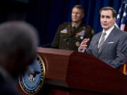 Pentagon spokesman John Kirby, accompanied by U.S. Army Major Gen. William Taylor, Joint Staff Operations, left, speaks during a briefing at the Pentagon in Washington, Friday, Aug. 20, 2021.