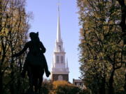 The Old North Church stands behind a statue of Paul Revere in the North End neighborhood of Boston.