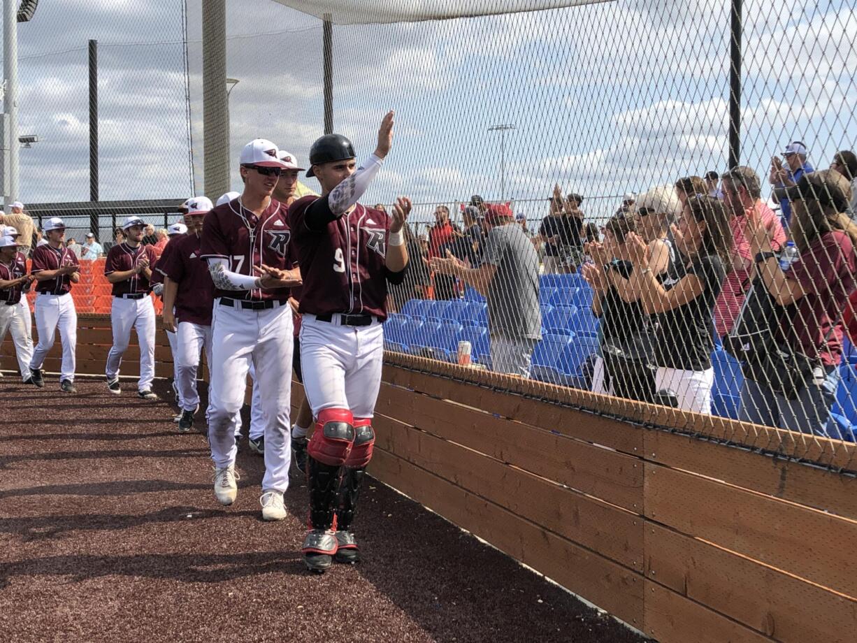 Ridgefield Raptors catcher Grant Heiser leads the team around the field to salute fans after Sunday's regular season home finale at Ridgefield Outdoor Recreation Complex.