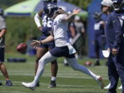 Seattle Seahawks punter Michael Dickson kicks during NFL football practice Thursday, July 29, 2021, in Renton, Wash. (AP Photo/Ted S.