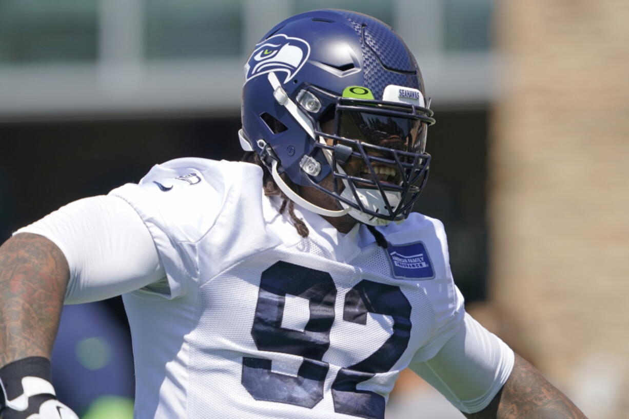 Seattle Seahawks defensive tackle Robert Nkemdiche reacts as he takes the field for NFL football practice Thursday, July 29, 2021, in Renton, Wash. (AP Photo/Ted S.