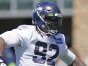 Seattle Seahawks defensive tackle Robert Nkemdiche reacts as he takes the field for NFL football practice Thursday, July 29, 2021, in Renton, Wash. (AP Photo/Ted S.